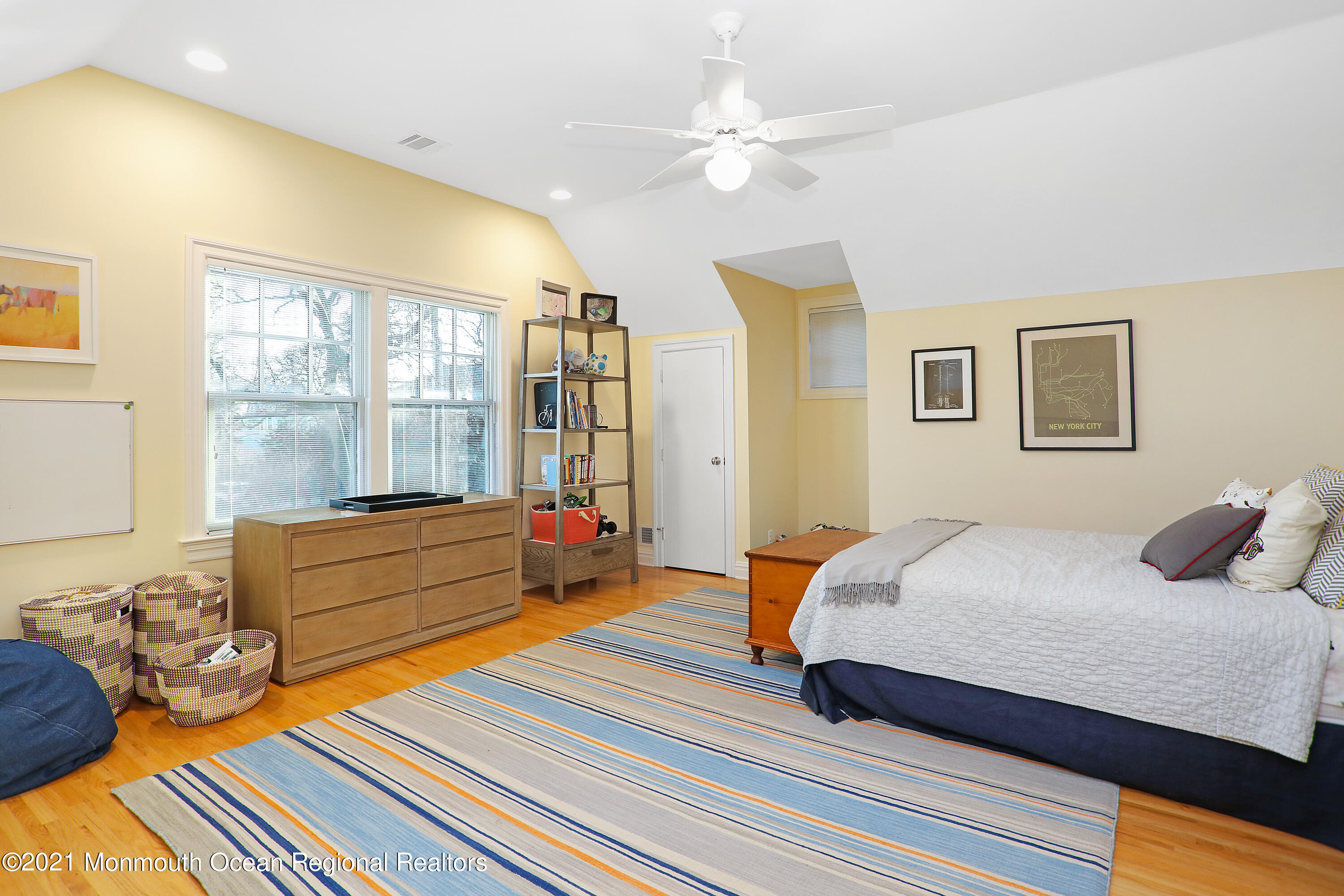 38 Vroom Avenue Spring Lake, NJ 07762 - Photo 12 of 15 a bedroom with a bed and wooden floor