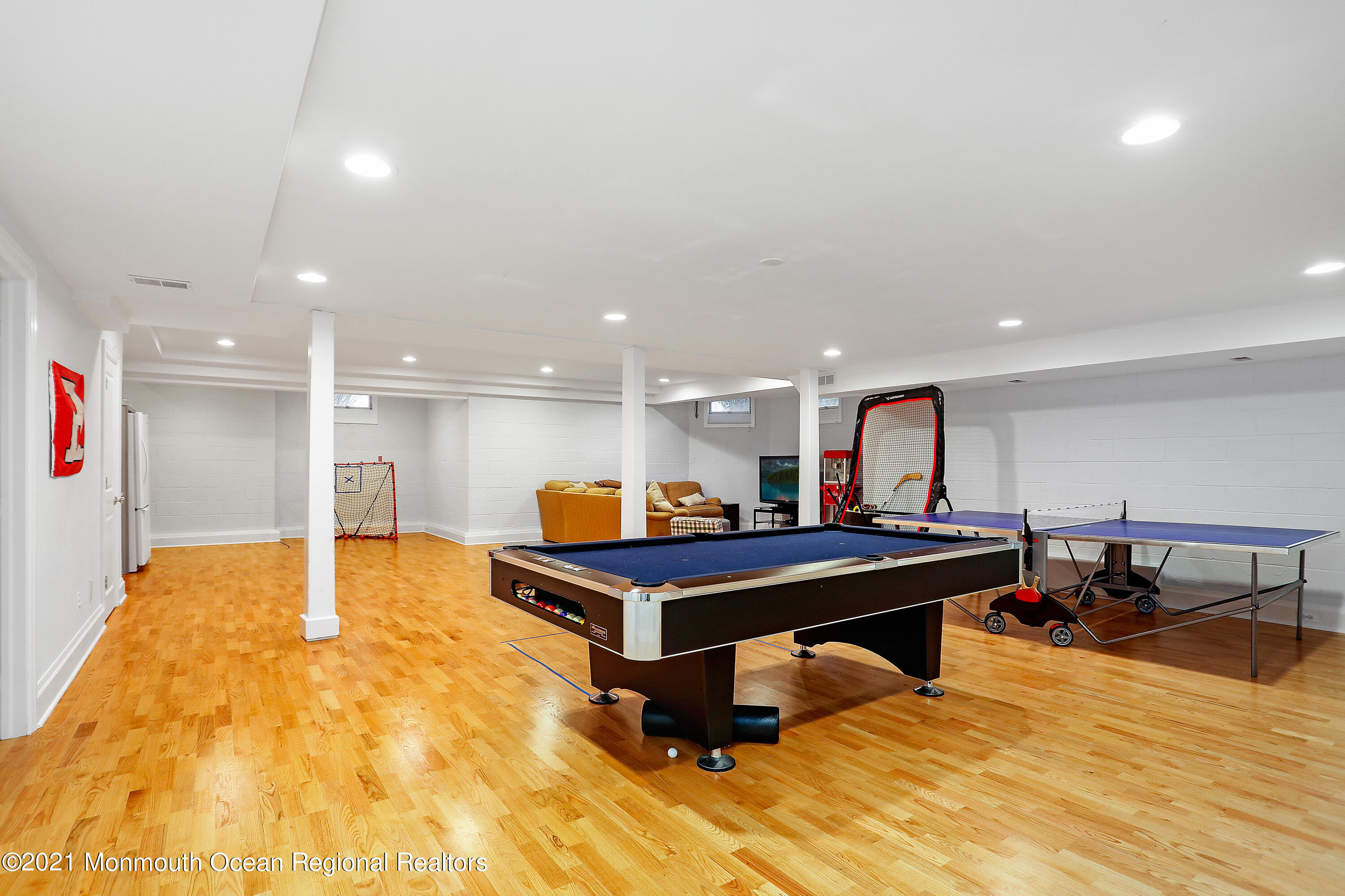 38 Vroom Avenue Spring Lake, NJ 07762 - Photo 13 of 15 a room with wooden floor pool table and windows