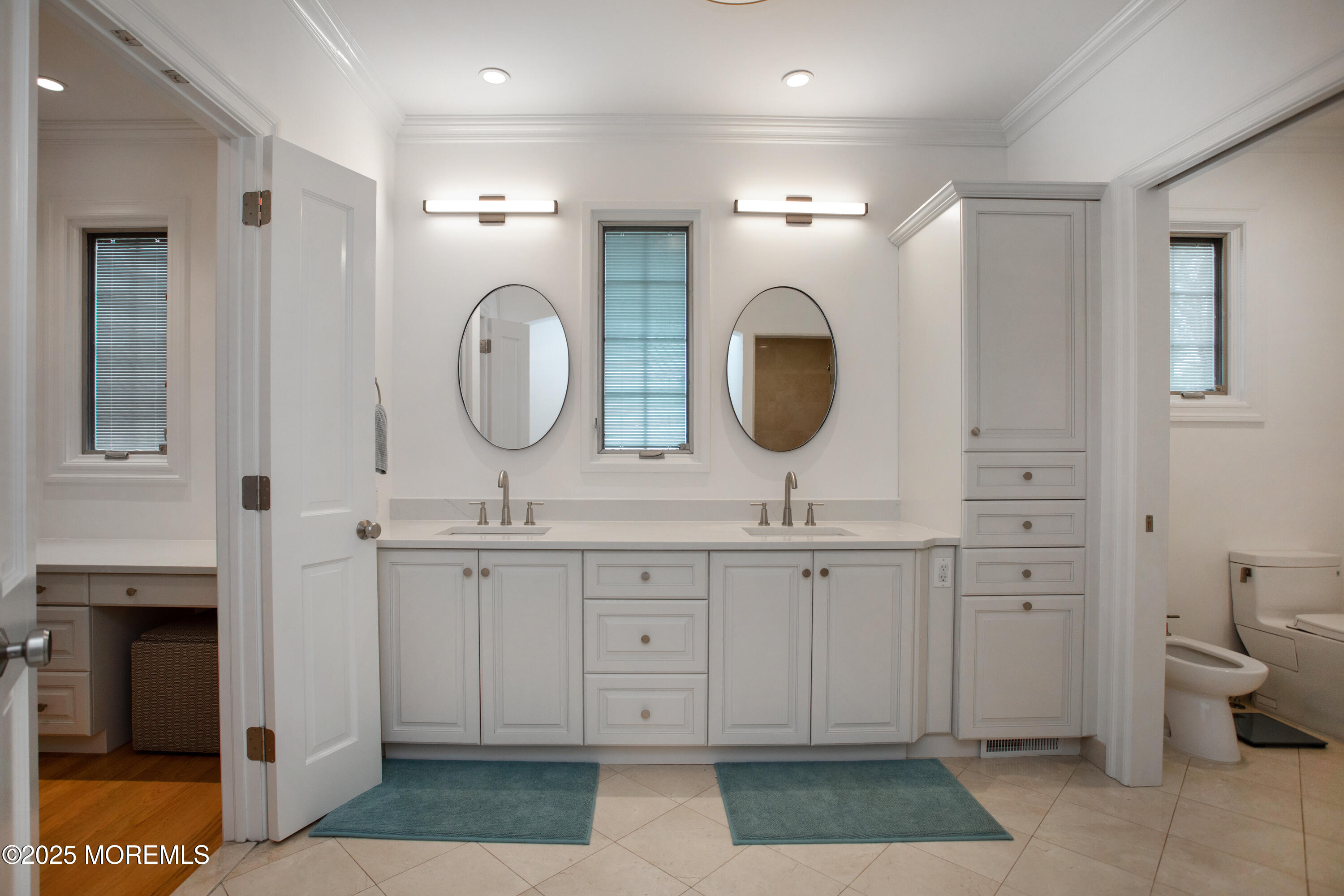 38 Vroom Avenue Spring Lake, NJ 07762 - Photo 8 of 15 a spacious bathroom with a double vanity sink a toilet and a mirror