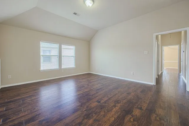 a kitchen with stainless steel appliances granite countertop a refrigerator a sink and a stove