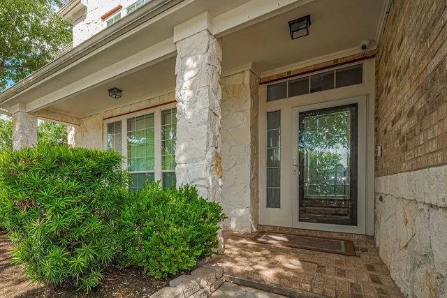 a view of an entryway with wooden floor