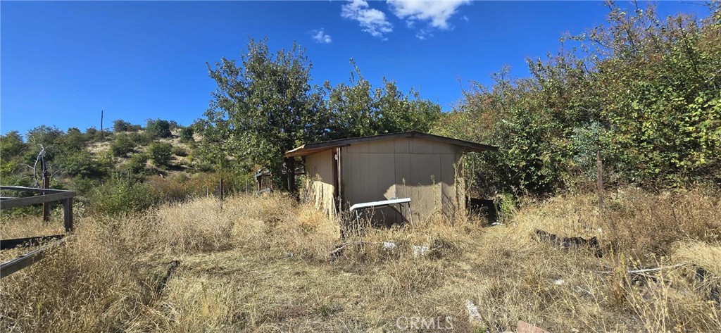 13495 Concow Road Oroville, CA 95965 - Photo 2 of 9 a backyard of a house with lots of green space