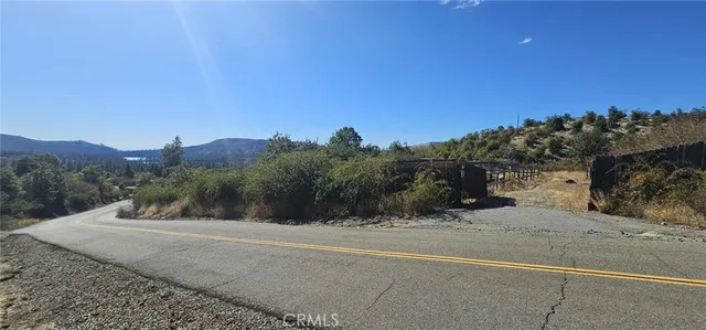 a view of a road with a building in the background