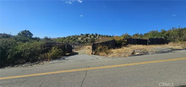 a view of a road with a building in the background