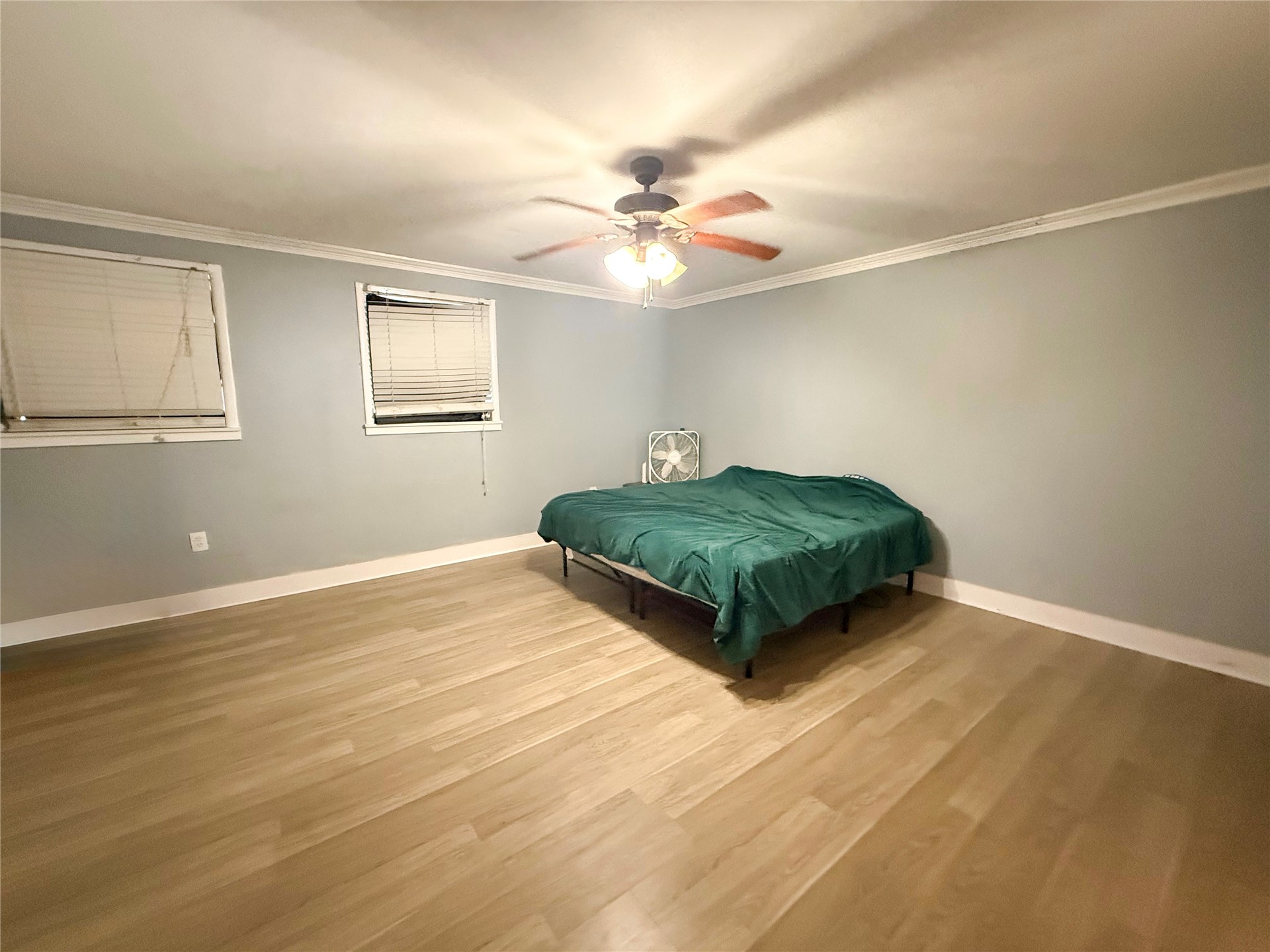 169 Center Street North Baldwin, FL 32234 - Photo 11 of 15 a living room with hard wood floors and a ceiling fan