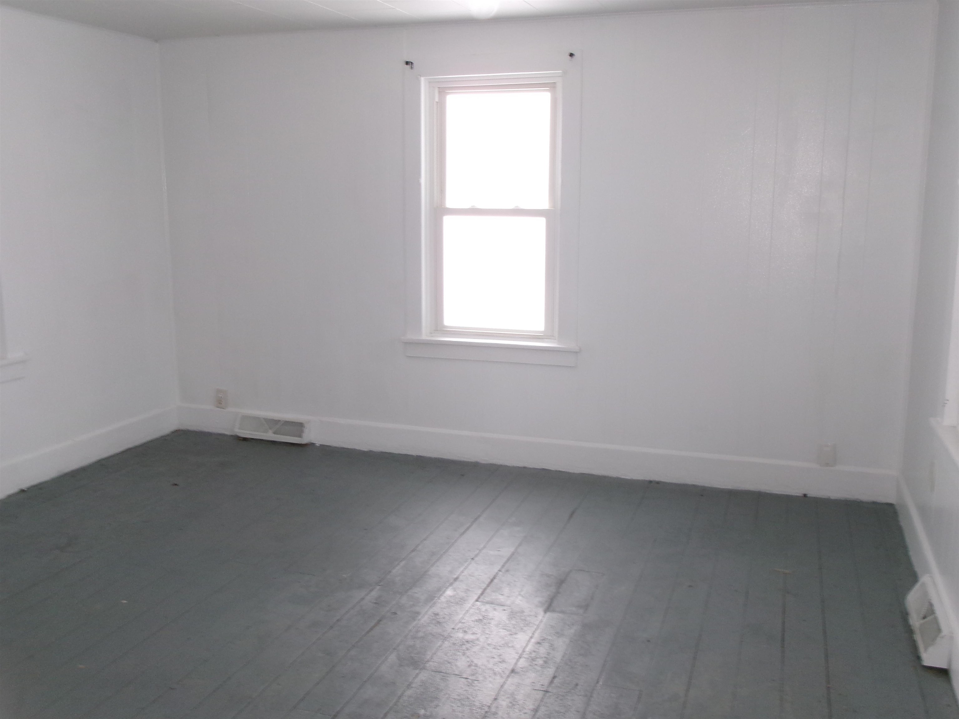 319 North Chestnut Street Princeton, IL 61356 - Photo 3 of 8 an empty room with a window