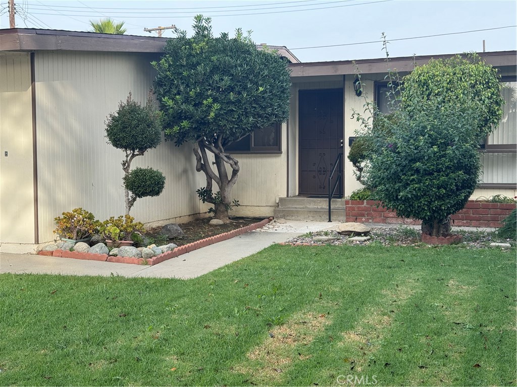 511 West 170th Street Gardena, CA 90248 - Photo 1 of 11 a front view of a house with garden
