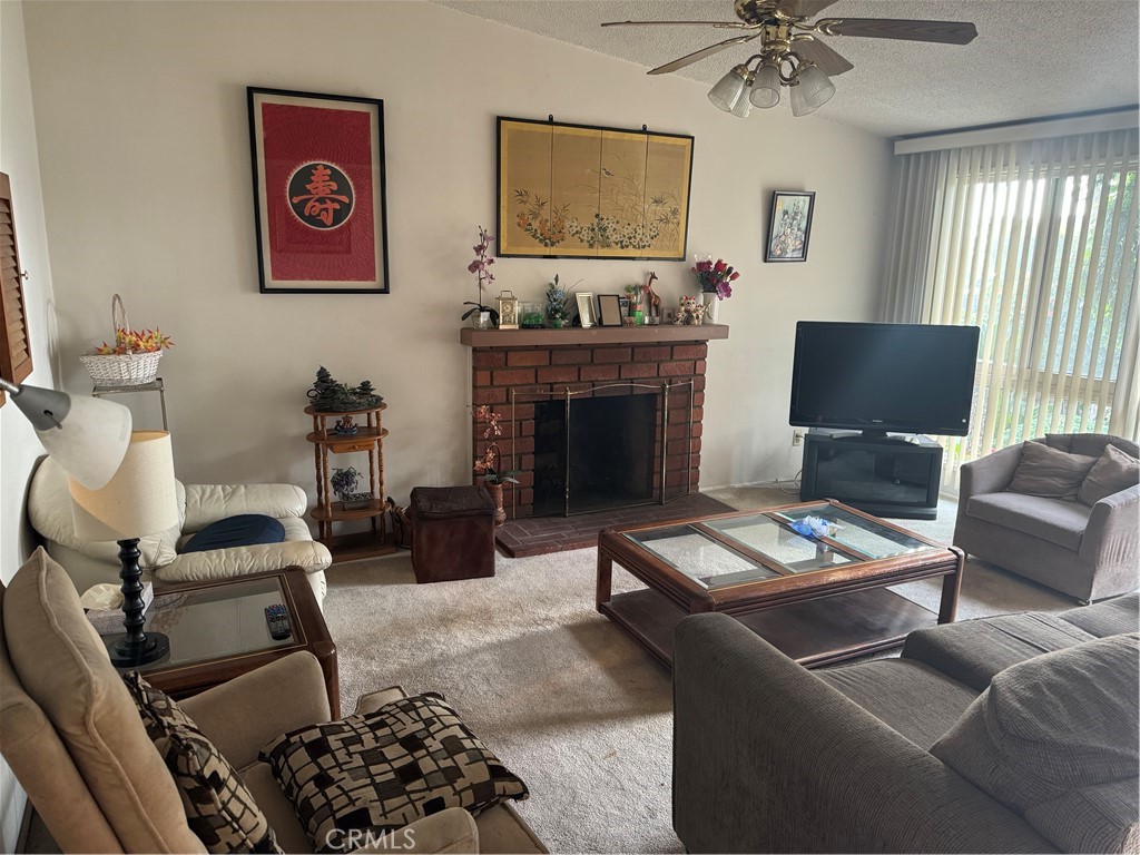 511 West 170th Street Gardena, CA 90248 - Photo 3 of 11 a living room with furniture and a fireplace