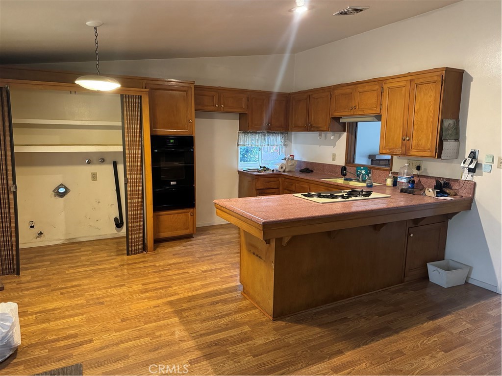 511 West 170th Street Gardena, CA 90248 - Photo 8 of 11 a kitchen with stainless steel appliances granite countertop a sink and a stove