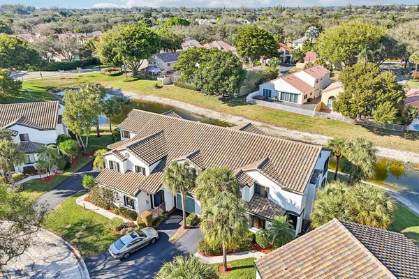 an aerial view of residential houses with outdoor space