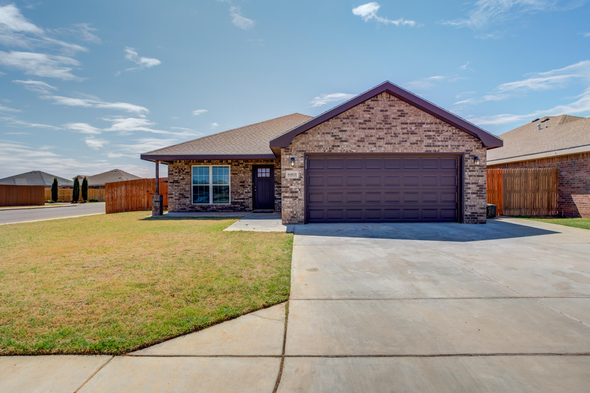 8801 15th Street Lubbock, TX 79416 - Photo 2 of 32 a front view of a house having yard