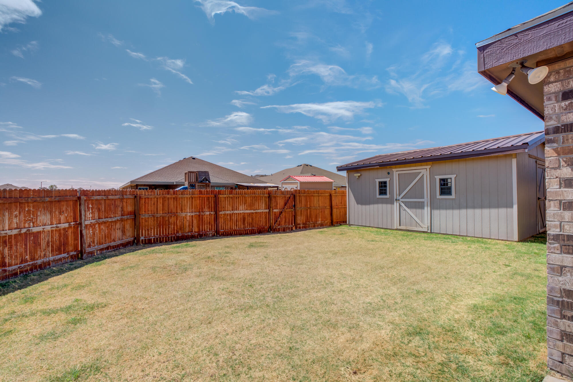 8801 15th Street Lubbock, TX 79416 - Photo 21 of 32 a view of an empty room with wooden fence