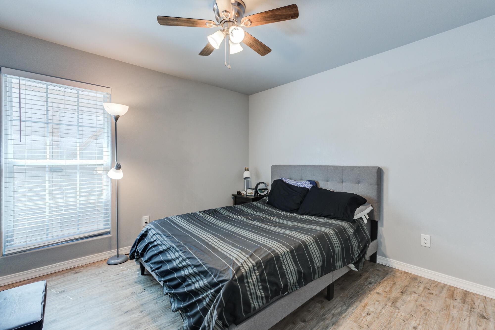 8801 15th Street Lubbock, TX 79416 - Photo 24 of 32 a bedroom with a bed and window