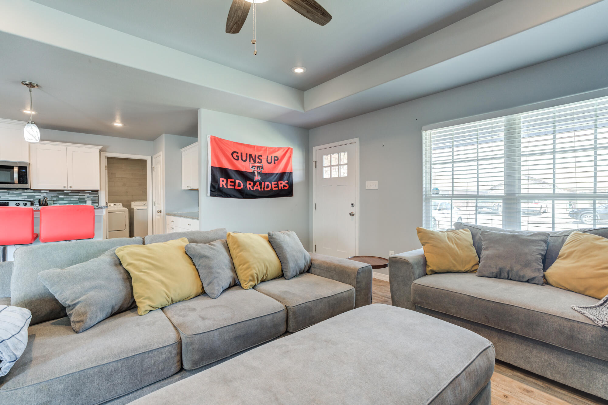 8801 15th Street Lubbock, TX 79416 - Photo 30 of 32 a living room with furniture and a large window
