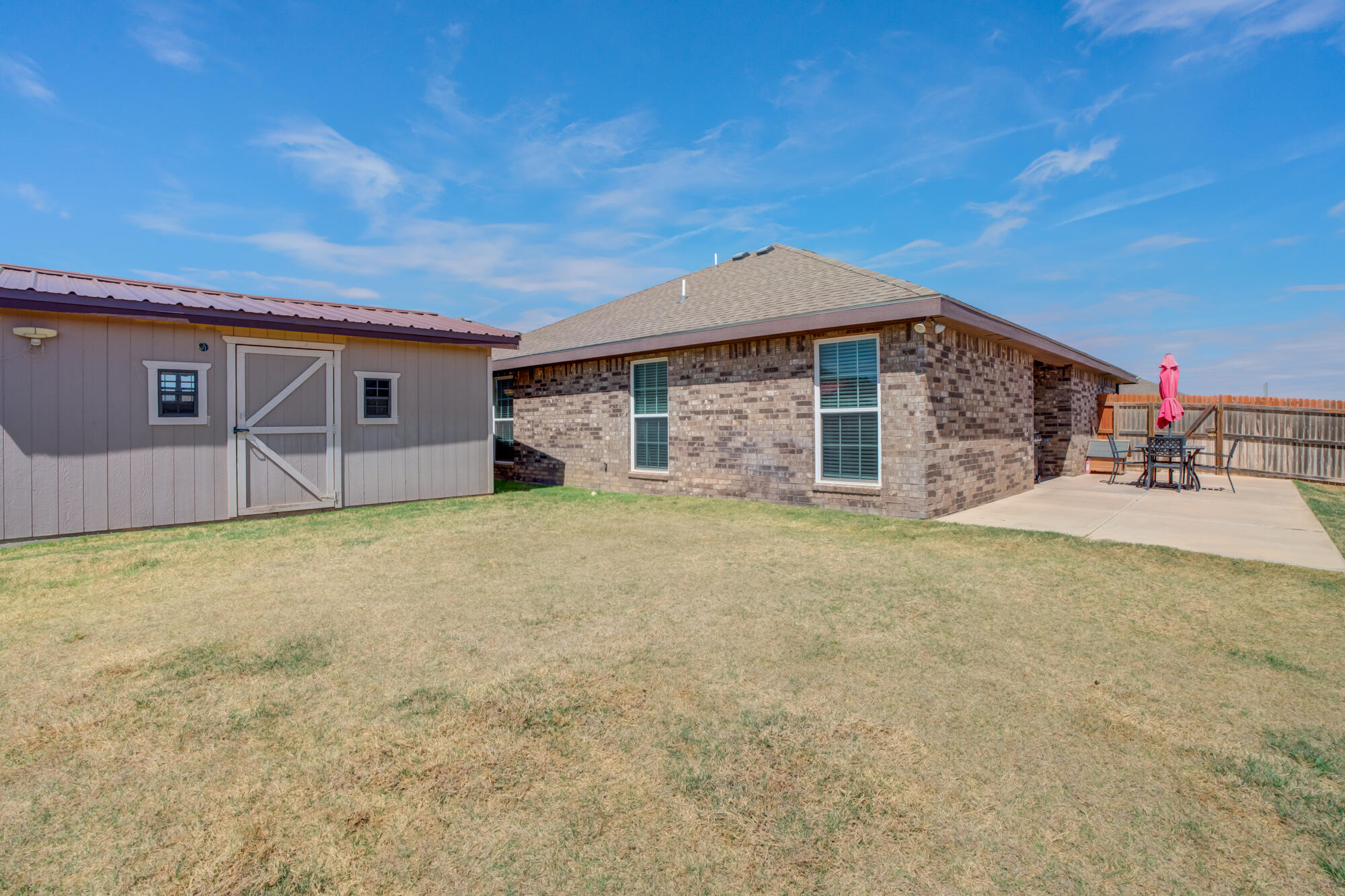 8801 15th Street Lubbock, TX 79416 - Photo 3 of 32 a house view with a backyard space