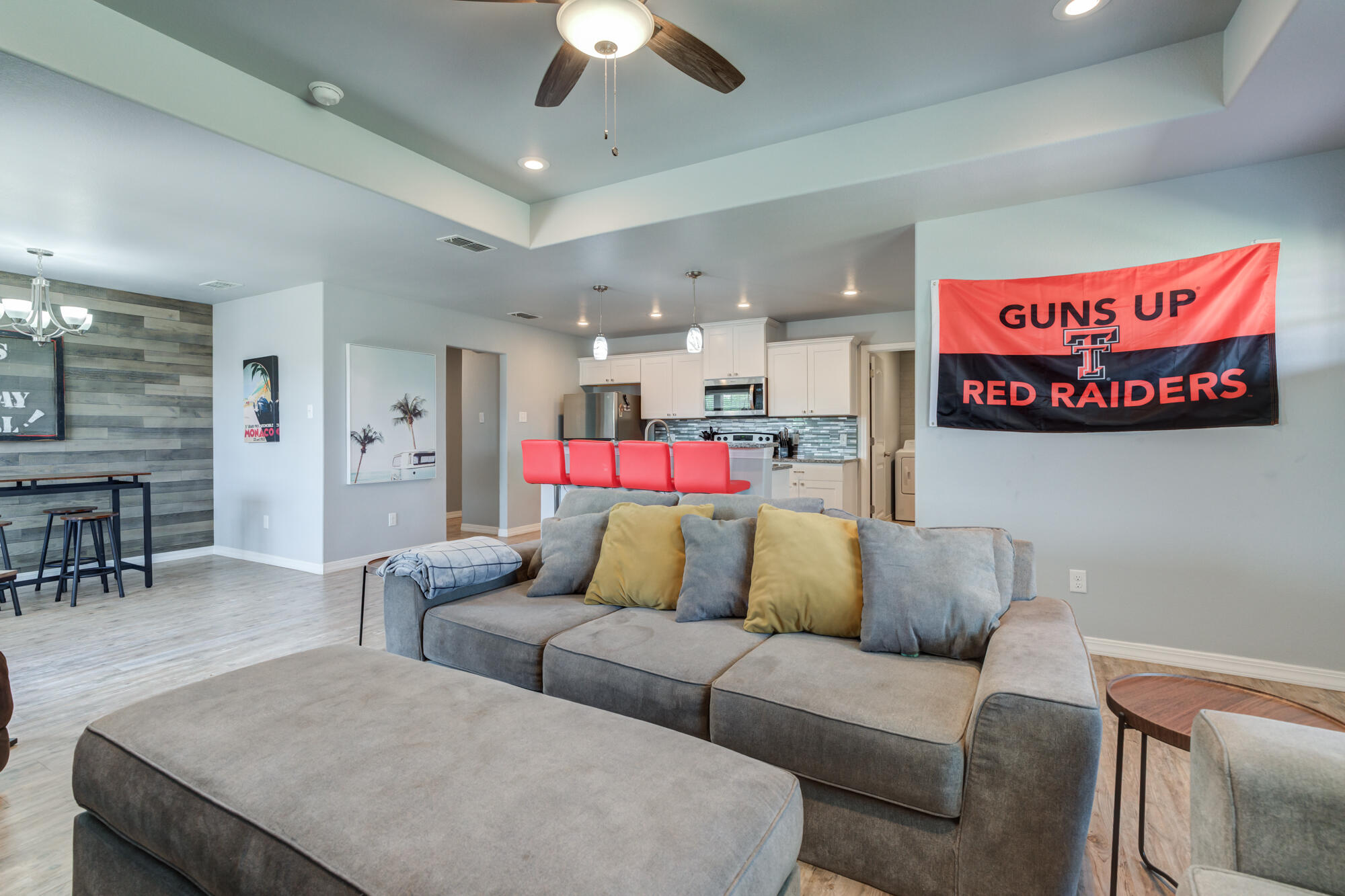 8801 15th Street Lubbock, TX 79416 - Photo 5 of 32 a living room with furniture and a chandelier