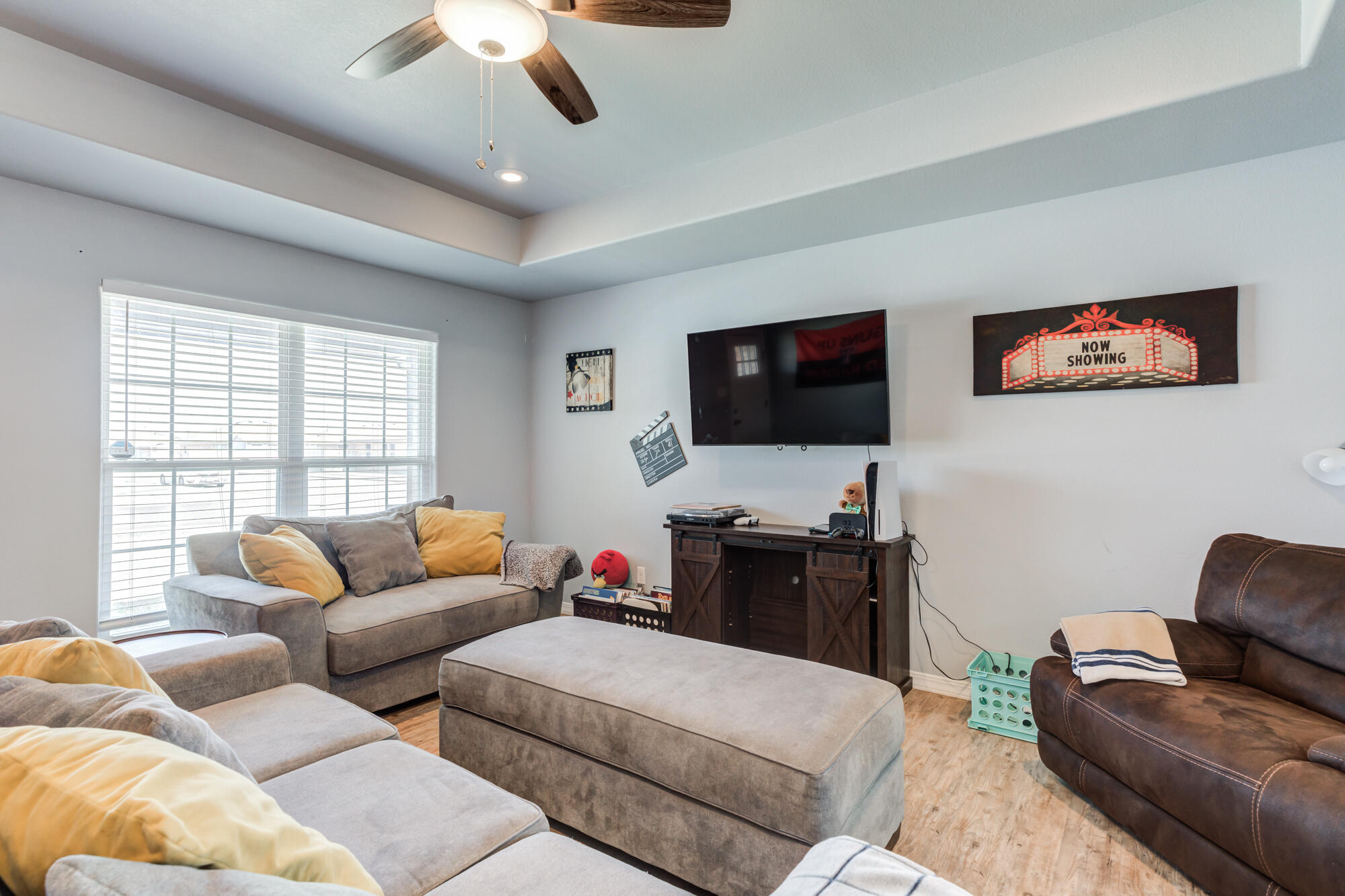 8801 15th Street Lubbock, TX 79416 - Photo 7 of 32 a living room with furniture and a flat screen tv