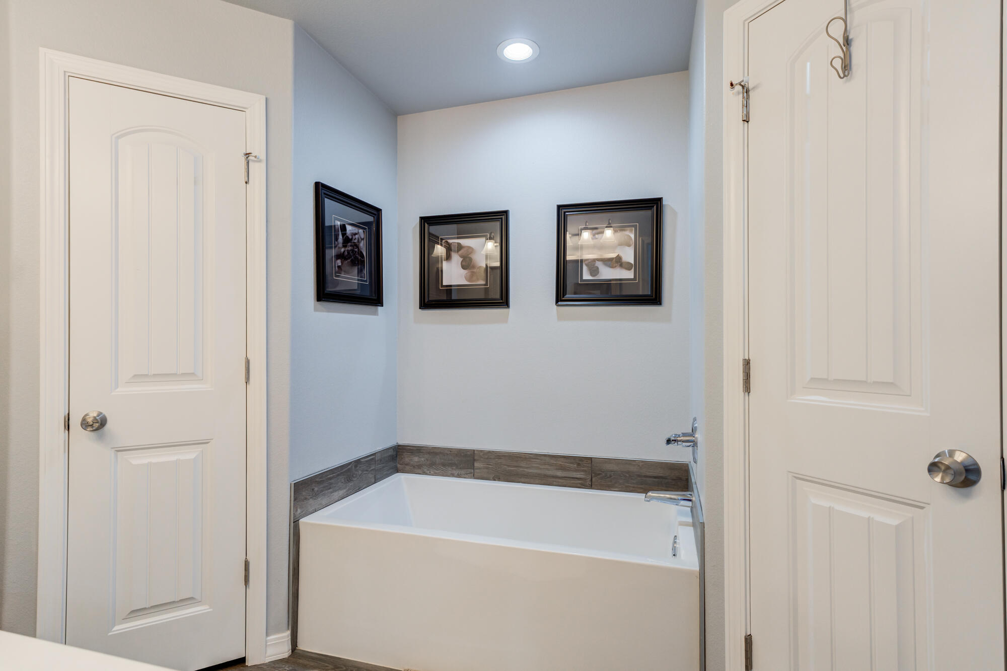 8801 15th Street Lubbock, TX 79416 - Photo 10 of 32 a bathroom with a tub and shower