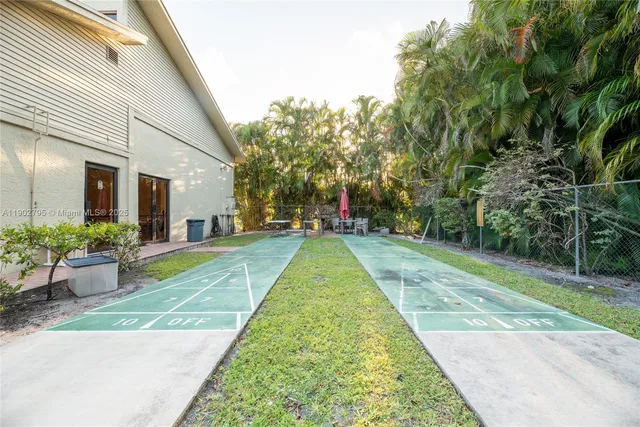 a view of yard with large trees