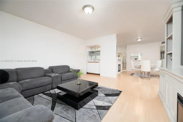 a living room with furniture and a rug