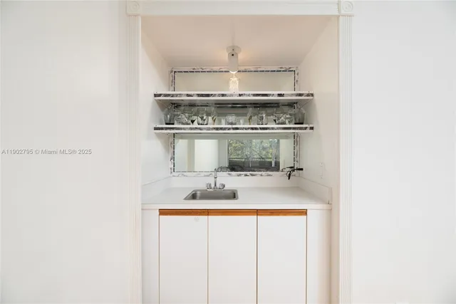 a stove top oven sitting inside of a kitchen