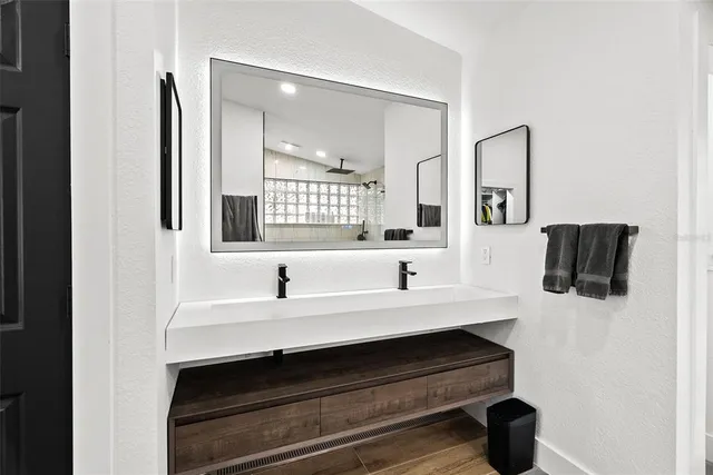a bathroom with a sink and a mirror
