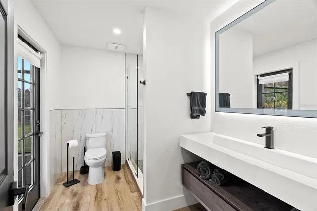 a kitchen with refrigerator and cabinets
