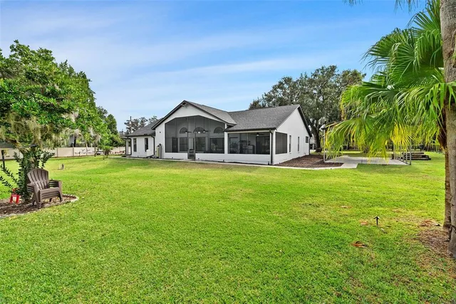 a view of a lake with houses sitting area and lake view