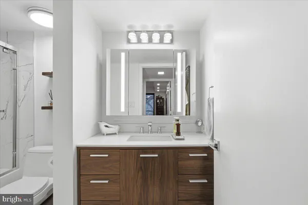 a bathroom with a double vanity sink and a mirror