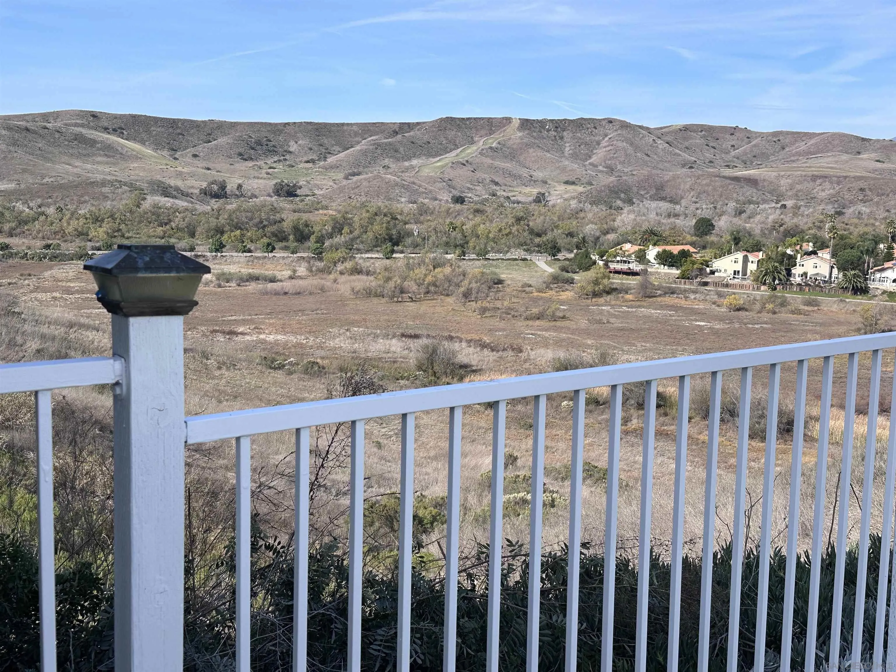 624 Carillo Circle Oceanside, CA 92057 - Photo 2 of 2 a view of a balcony with wooden floor and fence