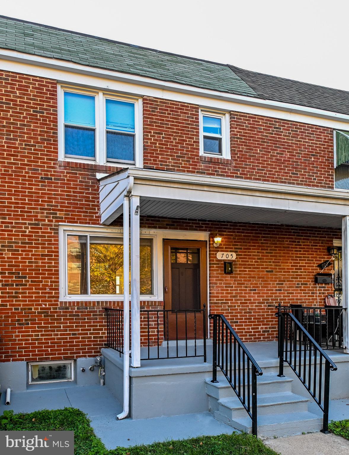 a view of front door of house with deck