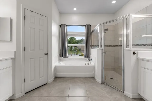 a bathroom with a bathtub shower and toilet
