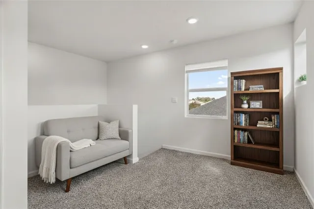 a living room with furniture and closet