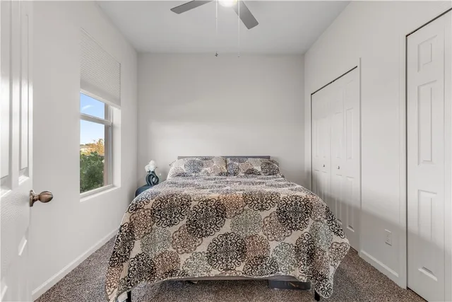 a bedroom with a bed and window