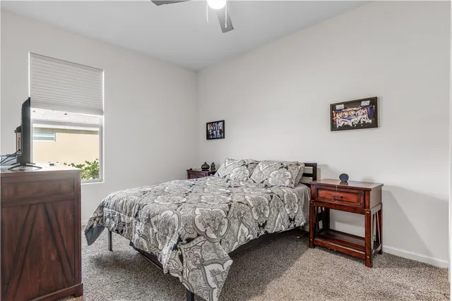 a bedroom with a bed and a dresser