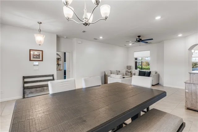 a view of a room with furniture and wooden floor
