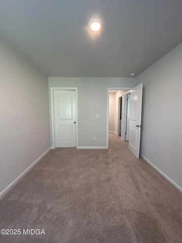 a view of an empty room and a windows