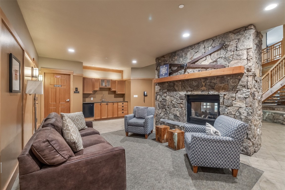910 Copper Road, Unit 226 Copper Mountain, CO 80443 - Photo 20 of 27 a living room with furniture and a fireplace