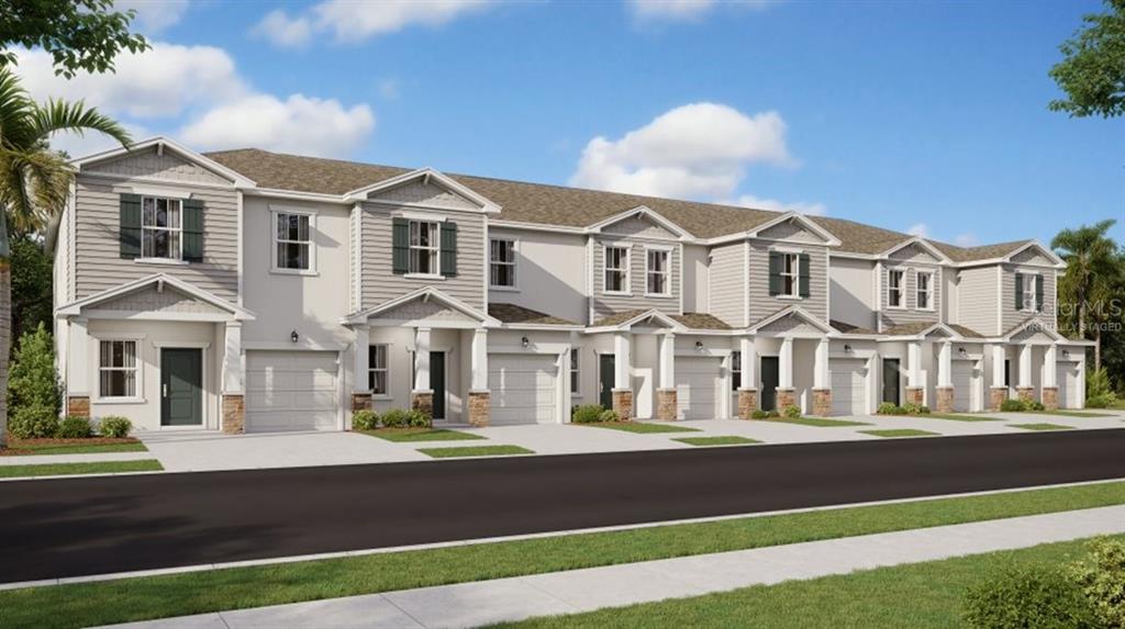2805 Skyline Loop Kissimmee, FL 34758 - Photo 1 of 1 a front view of residential houses with yard and road