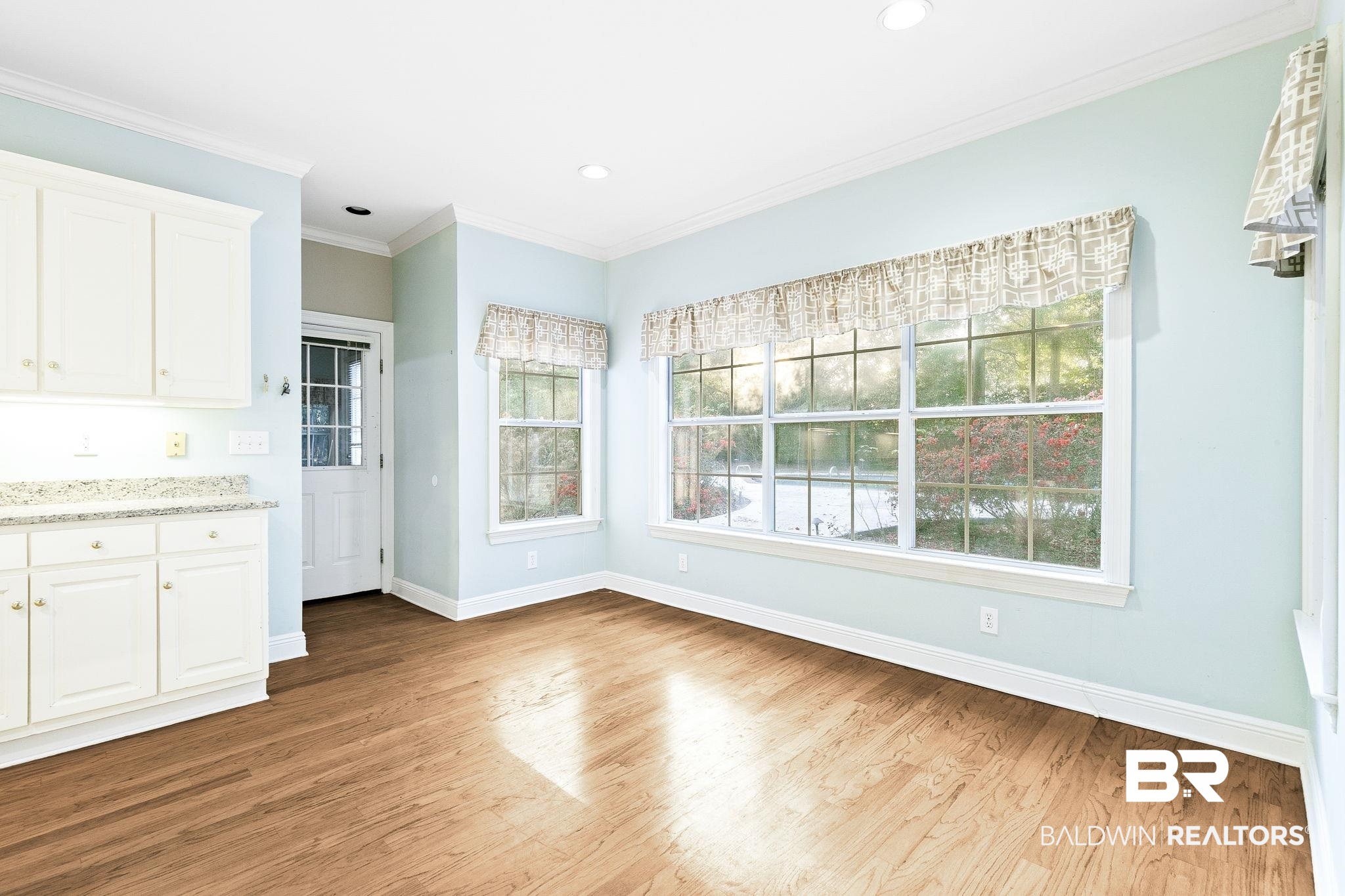 2100 Stonebrook Drive West Mobile, AL 36695 - Photo 22 of 60 Eat in Kitchen area with light hardwood / wood-style floors and crown molding