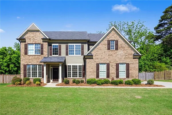 front view of a house with a yard