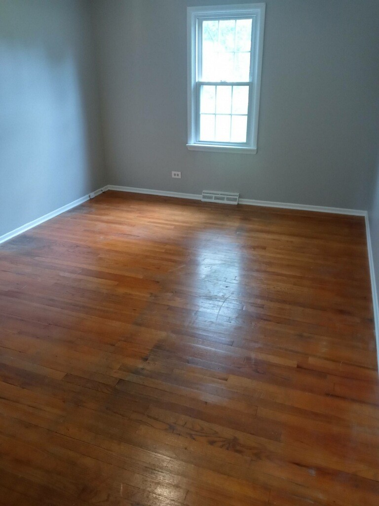 S528 Finley Road Lombard, IL 60148 - Photo 11 of 28 an empty room with wooden floor and windows