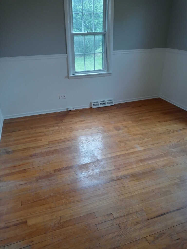 S528 Finley Road Lombard, IL 60148 - Photo 12 of 28 an empty room with wooden floor and windows