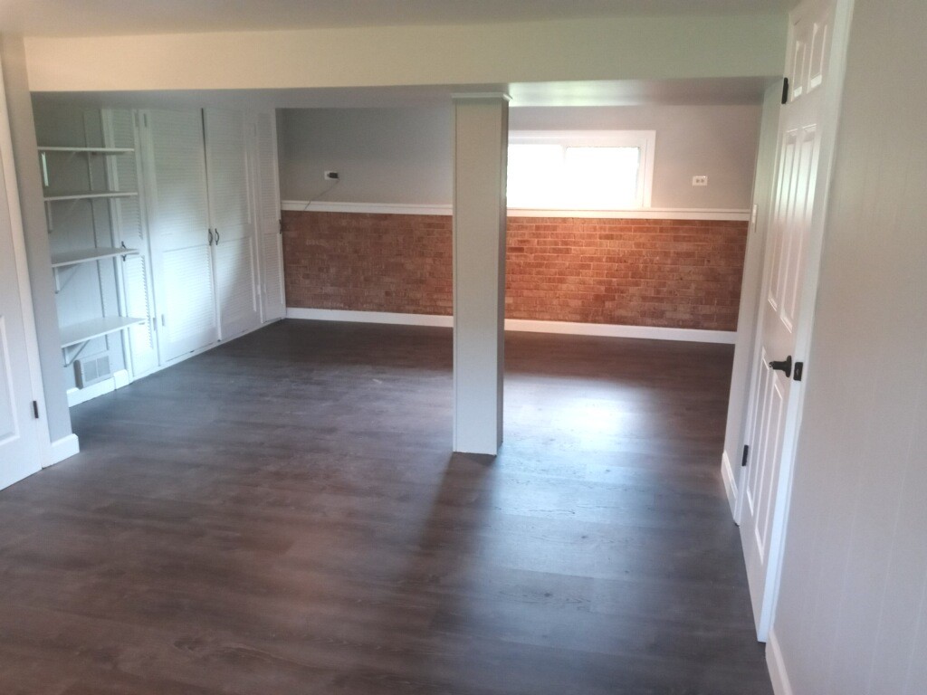 S528 Finley Road Lombard, IL 60148 - Photo 14 of 28 an empty room with wooden floor and windows
