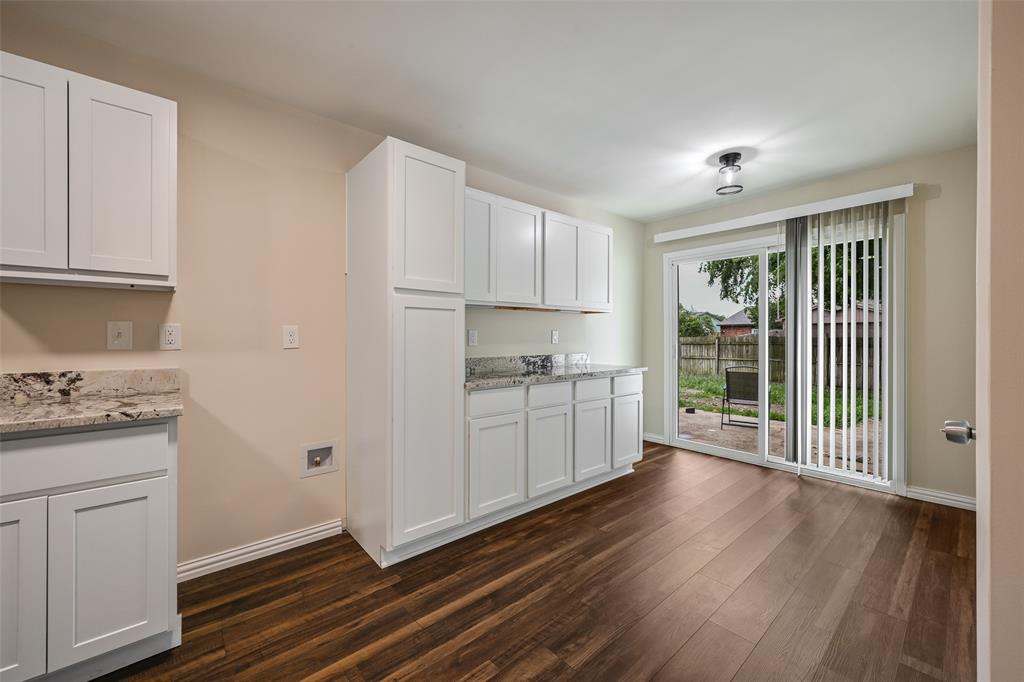 7318 Emory Oak Lane Dallas, TX 75249 - Photo 8 of 28 Kitchenette featuring white cabinetry, light-toned countertops, and wood-finish flooring