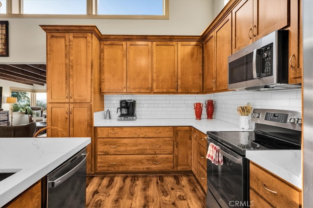 4565 Rock Corral Road Johnson Valley, CA 92285 - Photo 18 of 75 a kitchen with stainless steel appliances a sink stove and cabinets
