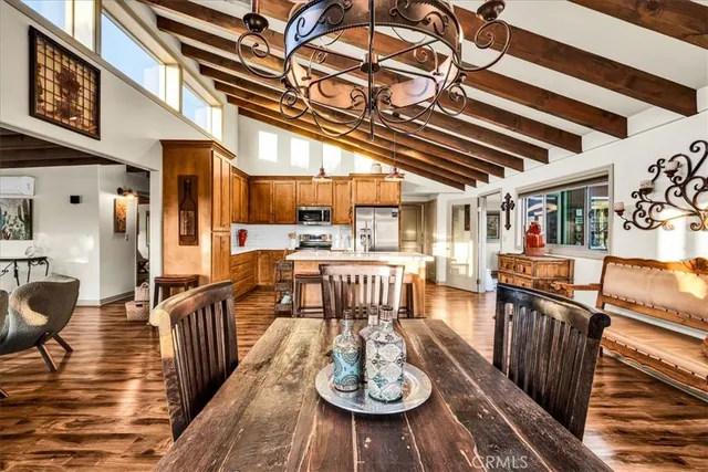 a living room with furniture and painting on the wall