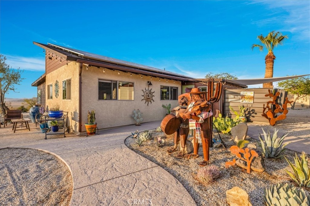4565 Rock Corral Road Johnson Valley, CA 92285 - Photo 34 of 75 a front view of a house with a yard