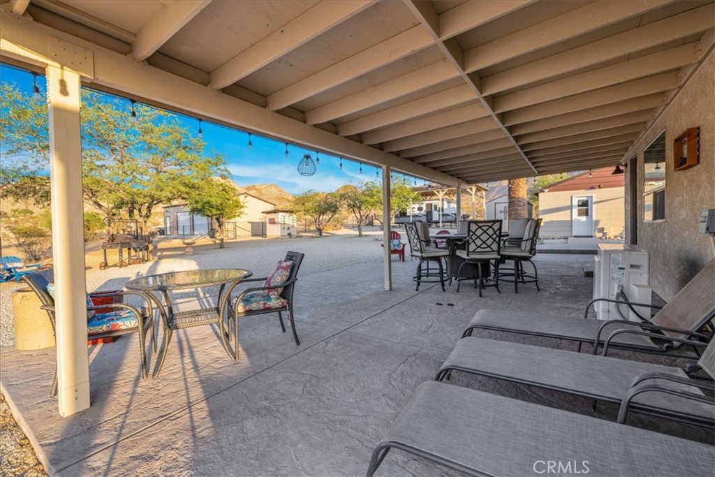 4565 Rock Corral Road Johnson Valley, CA 92285 - Photo 44 of 75 a view of a patio with chairs and tables