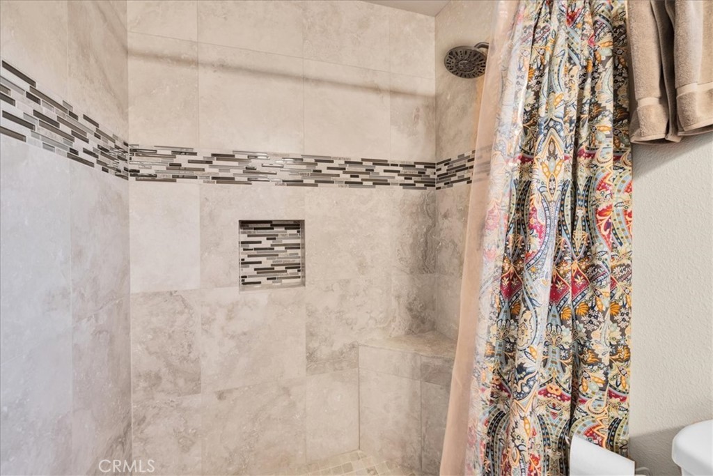 4565 Rock Corral Road Johnson Valley, CA 92285 - Photo 48 of 75 a view of a bathroom with a shower curtain